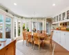 Dining room featuring  chandelier and 8 person table ( with leaf fits 12)