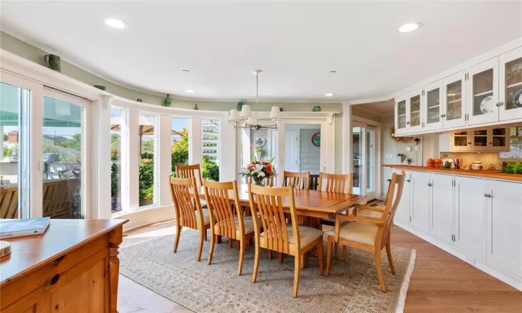 Dining room featuring  chandelier and 8 person table ( with leaf fits 12)