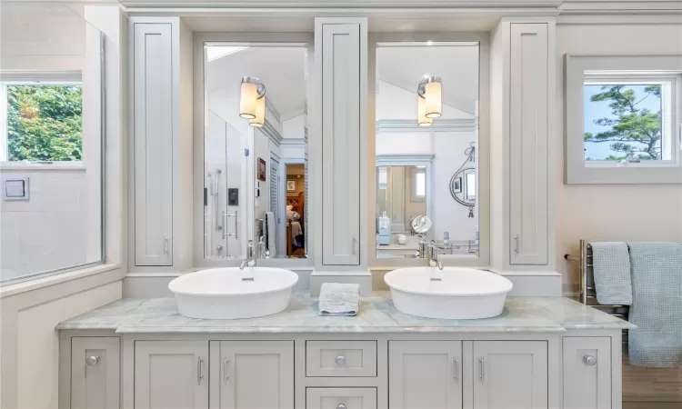 Full bathroom featuring double vanity and a sink