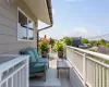 Second Floor deck with access to upstairs hall bathroom as well as second bedroom, one way glass skylight through to screened in porch below