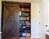 Built-In Bookshelves With Barn Door