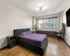 Bedroom featuring baseboards and hardwood / wood-style floors