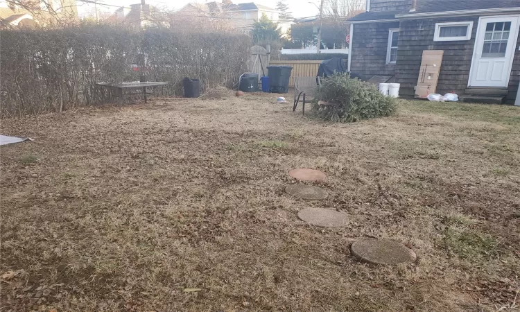 View of yard featuring entry steps