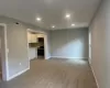 Unfurnished living room featuring recessed lighting, baseboards, visible vents, and light wood finished floors