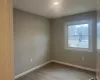 Empty room featuring baseboards, wood finished floors, and recessed lighting