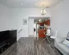 Dining area with visible vents, wood finished floors, an inviting chandelier, and recessed lighting