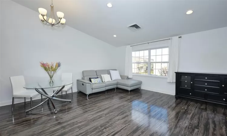 Dining area featuring visible vents, dark wood finished floors, a chandelier, and recessed lighting