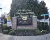 Community / neighborhood sign with a residential view