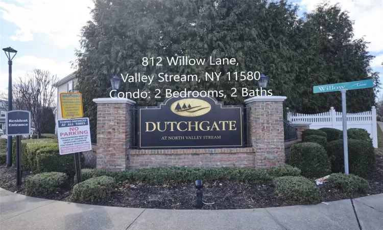 Community / neighborhood sign with a residential view