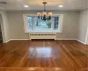 Dining area with recessed lighting, chandelier, large bay window