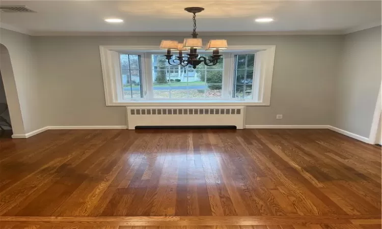 Dining area with recessed lighting, chandelier, large bay window