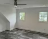 Unfurnished room with dark wood-type flooring, recessed lighting, ceiling fan, and baseboards