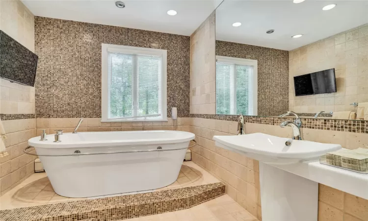 Fabulous main bath with tub filler from ceiling.