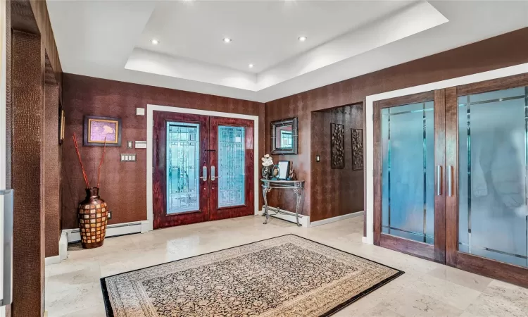 Stunning French door entry with Travertine Marble tiles throughout.