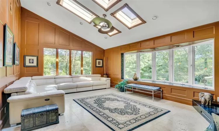 Sophisticated family room with windows all around.