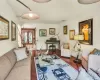 Living room featuring baseboards, visible vents, and wood finished floors