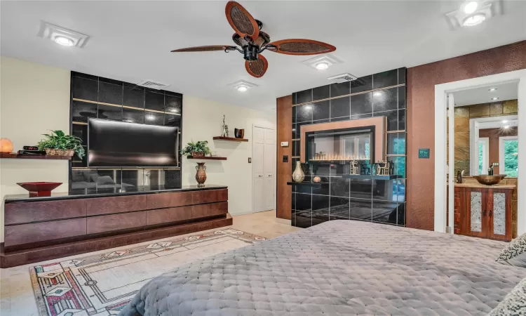 Bedroom featuring ceiling fan and visible vents