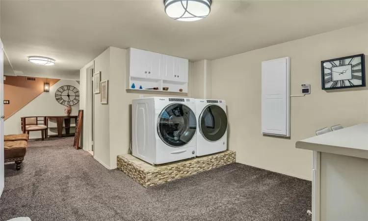 Enter into Laundry area with wall-ironing board.