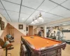 Recreation room featuring recessed lighting, carpet, a paneled ceiling, and baseboards