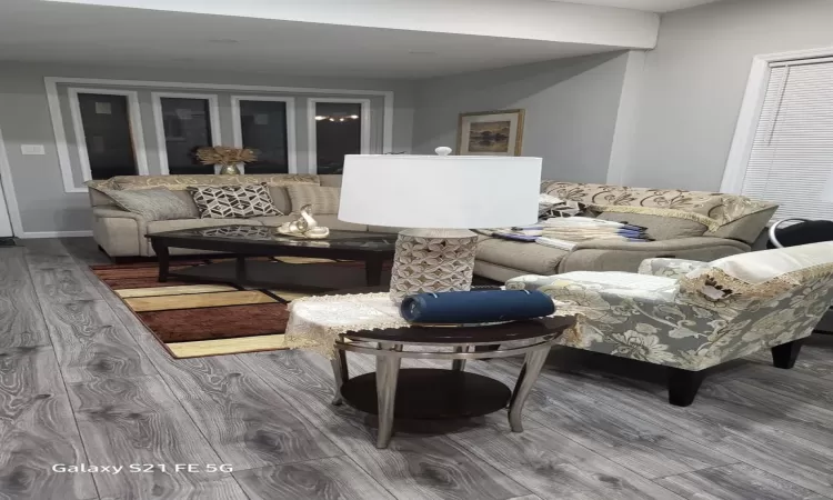 Living room with wood finished floors and baseboards