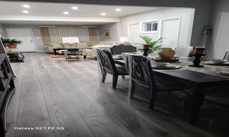 Dining space featuring wood finished floors and recessed lighting