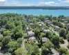 Birds eye view of property with a water view