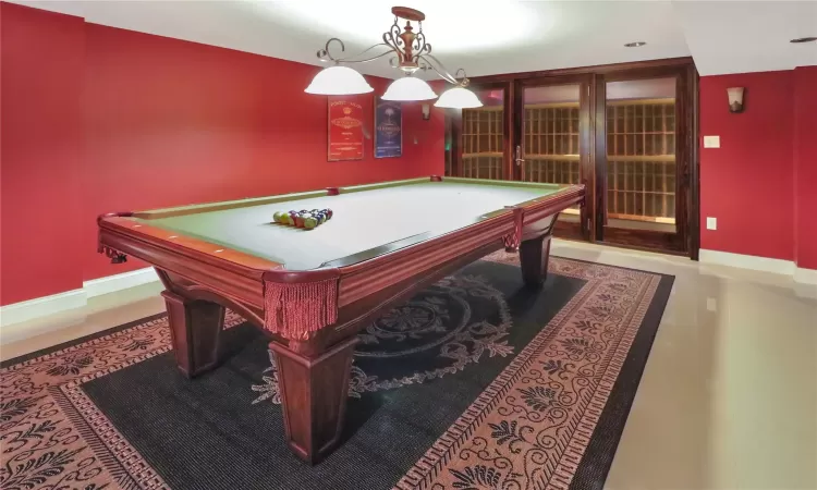 Rec room with pool table and walk in wine cellar