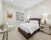 Bedroom with recessed lighting, light carpet, visible vents, and baseboards