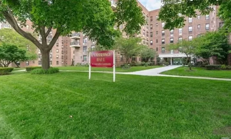 View of community featuring a lawn