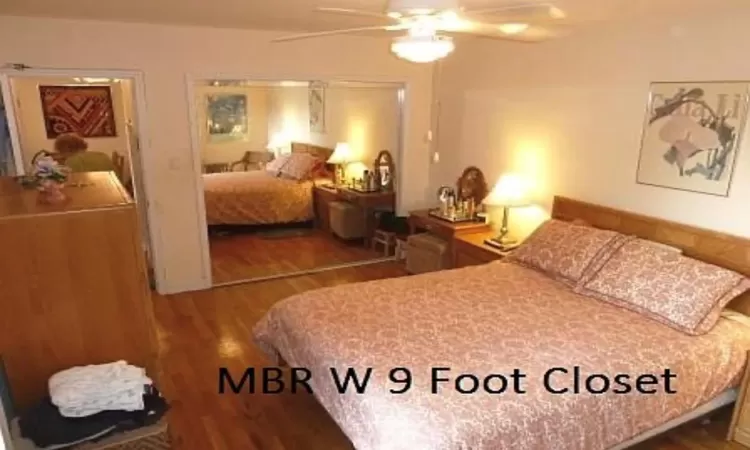 Bedroom with ceiling fan and wood finished floors