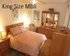 Bedroom featuring a ceiling fan and wood finished floors