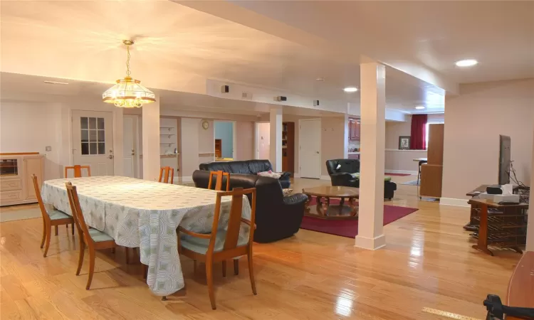 Dining room featuring light wood-style floors, recessed lighting, visible vents, and baseboards