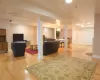 Living room featuring recessed lighting, light wood-type flooring, visible vents, and baseboards