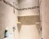 Full bath with tiled shower