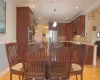 Dining space featuring ornamental molding, light wood-type flooring, and recessed lighting