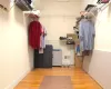 Walk in closet featuring visible vents and wood finished floors