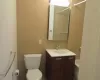 Bathroom with shower / bathtub combination, vanity, and toilet