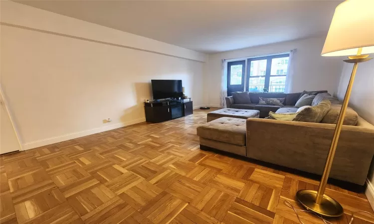 Living area featuring baseboards