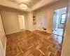 Kitchen featuring tasteful backsplash, radiator heating unit, stainless steel appliances, light countertops, and a sink