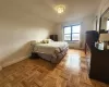 Bathroom with toilet, shower / tub combo, vanity, tile walls, and tile patterned floors