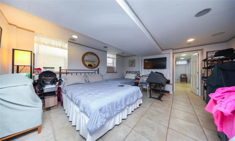 Bedroom with recessed lighting and light tile patterned flooring