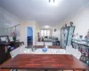 Dining area featuring wood finished floors and crown molding