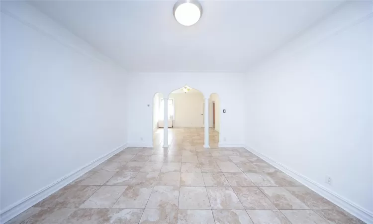 Unfurnished bedroom with a closet, dark carpet, and baseboards