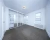 Dining area with crown molding, baseboards, and light wood-style floors