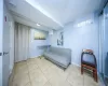 Sitting room featuring tile patterned floors and baseboards