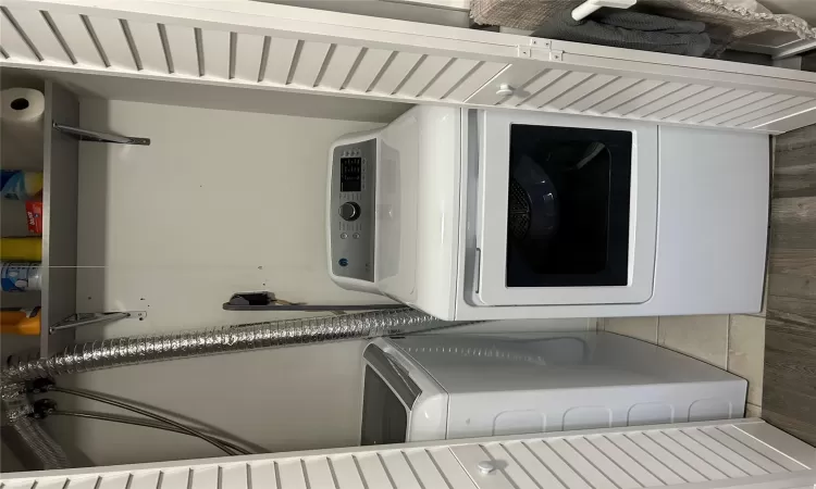 Laundry area featuring laundry area, separate washer and dryer, and light wood-style floors