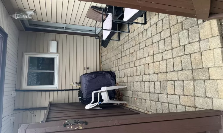 View of patio featuring area for grilling