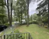 View of yard featuring fence and a playground