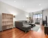 Living room featuring recessed lighting, baseboards, and hardwood / wood-style floors