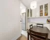 Dining space featuring baseboards and a notable chandelier